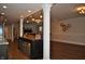 Finished basement features a wet bar with decorative accents and wood-look flooring at 16550 Gleneagles Ct, Noblesville, IN 46060