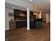 Finished basement bar features dark wood accents, bar seating, and rustic accents at 16550 Gleneagles Ct, Noblesville, IN 46060