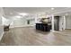 Open basement with stylish bar area, complete with bar stools, cabinetry, and recessed lighting at 16550 Gleneagles Ct, Noblesville, IN 46060