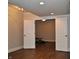 Basement view with double doors, recessed lights, and workout area beyond at 16550 Gleneagles Ct, Noblesville, IN 46060