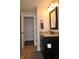 A compact bathroom features a granite countertop vanity and modern fixtures at 16550 Gleneagles Ct, Noblesville, IN 46060