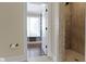 Bathroom with a walk-in shower, toilet, and a view into the closet with natural lighting at 16550 Gleneagles Ct, Noblesville, IN 46060