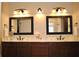 Bright bathroom with a double sink vanity, framed mirrors, and stylish lighting at 16550 Gleneagles Ct, Noblesville, IN 46060