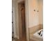Bathroom with walk-in shower and tiled walls next to soaking tub at 16550 Gleneagles Ct, Noblesville, IN 46060