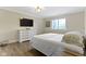 Cozy bedroom with a white dresser, window, neutral tones, and modern decor for a relaxing retreat at 16550 Gleneagles Ct, Noblesville, IN 46060