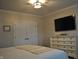 This bedroom features a TV and a chest of drawers against a neutral wall at 16550 Gleneagles Ct, Noblesville, IN 46060