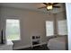 Spacious bedroom with multiple windows, ceiling fan, and simple furnishings at 16550 Gleneagles Ct, Noblesville, IN 46060