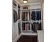 Walk-in closet featuring custom shelving and storage with hanging racks at 16550 Gleneagles Ct, Noblesville, IN 46060