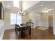 Dining room featuring wood floors, natural light, and stylish decor at 16550 Gleneagles Ct, Noblesville, IN 46060