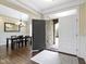 Elegant entryway featuring hardwood floors, a decorative chandelier, and an open view to the dining room at 16550 Gleneagles Ct, Noblesville, IN 46060