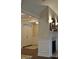 Bright foyer with double front doors, wainscotting, and a fireplace at 16550 Gleneagles Ct, Noblesville, IN 46060
