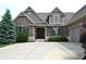 Beautiful brick home featuring a double door entry, manicured landscaping and concrete driveway at 16550 Gleneagles Ct, Noblesville, IN 46060