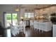 Open-concept kitchen with island, stainless steel appliances, and access to a deck at 16550 Gleneagles Ct, Noblesville, IN 46060