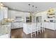 Bright kitchen with granite counters, stainless steel appliances, and a center island with barstool seating at 16550 Gleneagles Ct, Noblesville, IN 46060