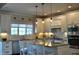 Well-lit kitchen with granite countertops, stainless steel appliances and bar seating at 16550 Gleneagles Ct, Noblesville, IN 46060