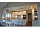 Beautiful kitchen with white cabinets, granite countertops, stainless appliances, and bar seating at 16550 Gleneagles Ct, Noblesville, IN 46060