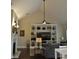 Living room with vaulted ceiling, built-in shelving, and a fireplace at 16550 Gleneagles Ct, Noblesville, IN 46060