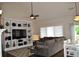 Cozy living room with built-in shelving and a ceiling fan at 16550 Gleneagles Ct, Noblesville, IN 46060