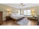 Inviting main bedroom featuring hardwood floors, neutral walls, ample natural light, and a comfortable sitting area at 16550 Gleneagles Ct, Noblesville, IN 46060