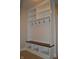 Mudroom with built-in storage, bench, and coat hooks at 16550 Gleneagles Ct, Noblesville, IN 46060