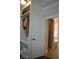 Custom built-in shelving with bench seating in this walk-in closet, leading to an en-suite bathroom at 16550 Gleneagles Ct, Noblesville, IN 46060