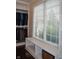 Bright walk-in closet with a window seat and custom shelves for storing clothing at 16550 Gleneagles Ct, Noblesville, IN 46060