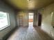 Bedroom features hardwood floors, a built-in shelf, and view of kitchen at 1739 E 18Th St, Anderson, IN 46016