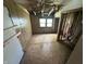 Bedroom with unfinished floors and damaged walls and ceiling at 1739 E 18Th St, Anderson, IN 46016