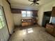 Spacious kitchen needing repairs showcases potential, featuring ample light and cabinet space at 1739 E 18Th St, Anderson, IN 46016