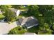 A high angle aerial view of a home in a green, lush, residential neighborhood at 1819 Quiet Haven Cir, Indianapolis, IN 46229