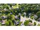 A wide aerial view of homes in a green, lush, residential neighborhood at 1819 Quiet Haven Cir, Indianapolis, IN 46229