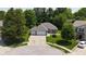 A bird's-eye view of a house with a neat lawn, mature landscaping, and a spacious two-car garage, highlighting its appealing exterior at 1819 Quiet Haven Cir, Indianapolis, IN 46229
