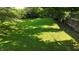 Spacious backyard featuring well-maintained lawn, mature trees and a wood fence for a private outdoor space at 1819 Quiet Haven Cir, Indianapolis, IN 46229