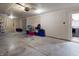 Unfinished basement featuring concrete floor, storage containers, and utility connections at 1819 Quiet Haven Cir, Indianapolis, IN 46229