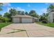 Charming home with a two-car garage and a spacious driveway, complemented by a well-maintained lawn at 1819 Quiet Haven Cir, Indianapolis, IN 46229