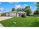 Beautiful home with a well-manicured lawn, mature landscaping, and a spacious driveway at 1819 Quiet Haven Cir, Indianapolis, IN 46229