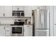 Modern kitchen showcasing stainless steel appliances and white cabinetry for a clean look at 1819 Quiet Haven Cir, Indianapolis, IN 46229