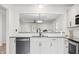 Well-appointed kitchen with a black dishwasher and contrasting granite countertops at 1819 Quiet Haven Cir, Indianapolis, IN 46229