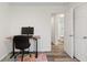 Bright home office featuring a desk, chair, and a view into the adjacent bathroom at 1819 Quiet Haven Cir, Indianapolis, IN 46229