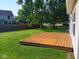 Wooden deck in a fenced backyard with plenty of space for outdoor activities at 18851 Wimbley Way, Noblesville, IN 46060