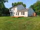 Spacious backyard featuring a wooden deck and lush green lawn at 18851 Wimbley Way, Noblesville, IN 46060