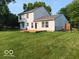 Expansive backyard view featuring a wooden deck and lush green lawn at 18851 Wimbley Way, Noblesville, IN 46060