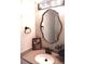 Bathroom with white sink, granite countertops, and unique lighting fixture at 18851 Wimbley Way, Noblesville, IN 46060