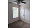 Bedroom featuring neutral carpet, ceiling fan, window, and white door at 18851 Wimbley Way, Noblesville, IN 46060