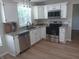Bright kitchen featuring white cabinets, granite countertops, and stainless steel appliances at 18851 Wimbley Way, Noblesville, IN 46060