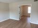 Hardwood flooring in a living room featuring glass paneled doors to another room at 18851 Wimbley Way, Noblesville, IN 46060