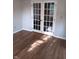 Office space with hardwood flooring and double glass paneled doors at 18851 Wimbley Way, Noblesville, IN 46060