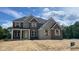 Charming new two-story home showcasing brick and stone accents, complemented by stylish shutters and an inviting front entrance at 1919 Delp Ct, Avon, IN 46123