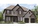 Inviting two-story home featuring a blend of brick and stone with a two-car garage at 1919 Delp Ct, Avon, IN 46123