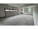 Spacious two car garage with two windows and two metal overhead doors with window panes at 1919 Delp Ct, Avon, IN 46123